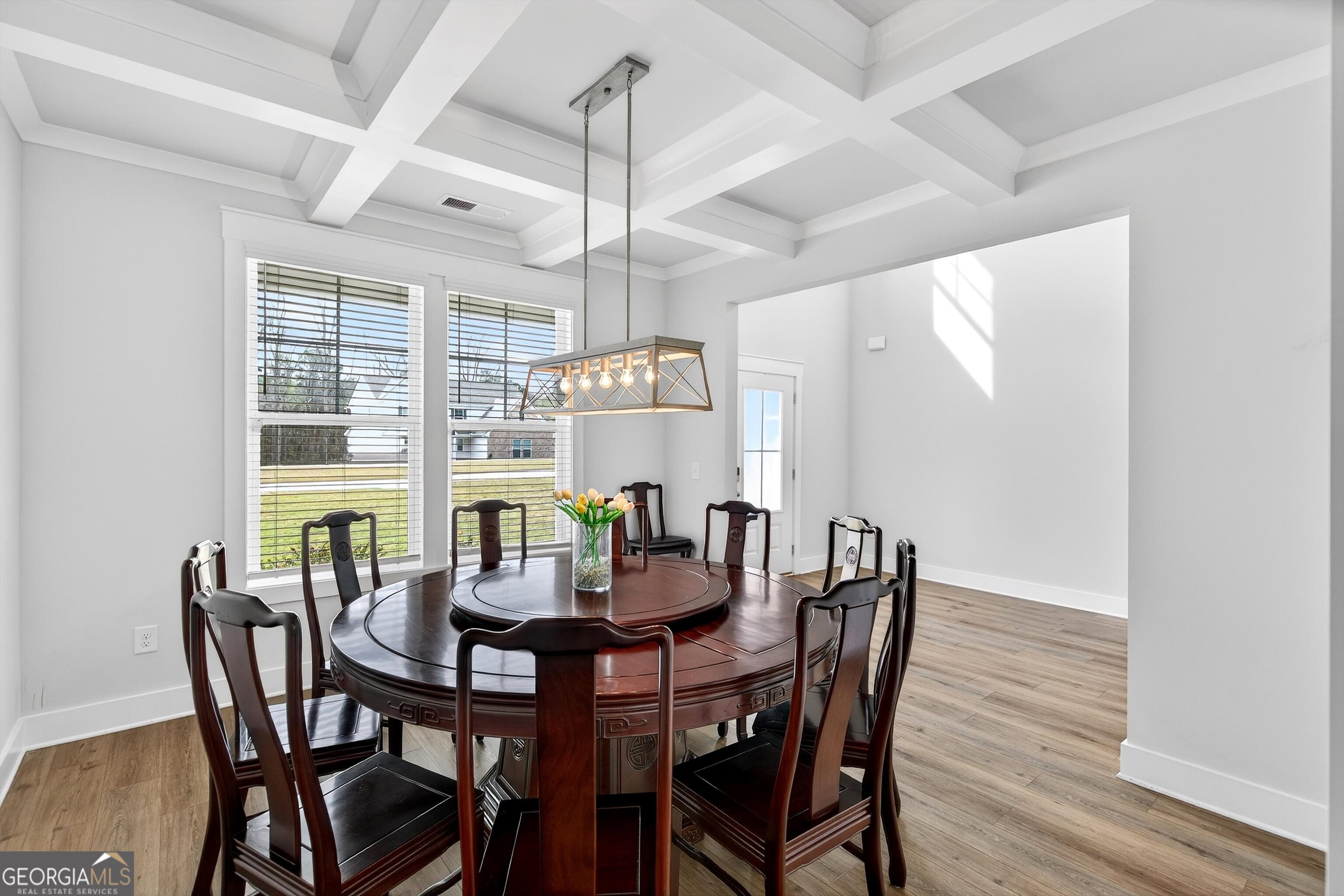 299 Saddleridge Trail Senoia, GA 30276 - Photo 6 of 56 a view of a dining room with furniture window and wooden floor