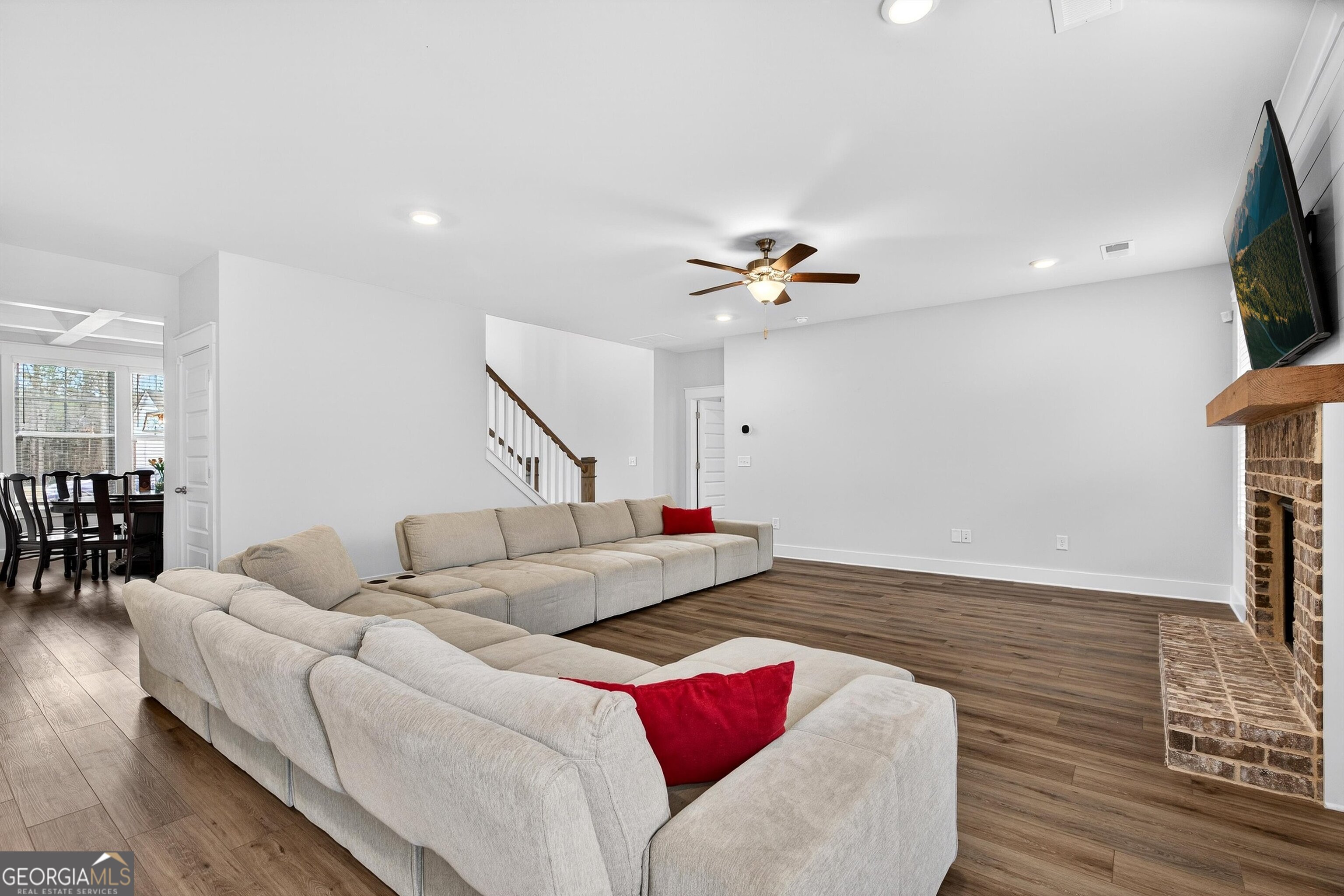 299 Saddleridge Trail Senoia, GA 30276 - Photo 9 of 56 a living room with furniture and a flat screen tv