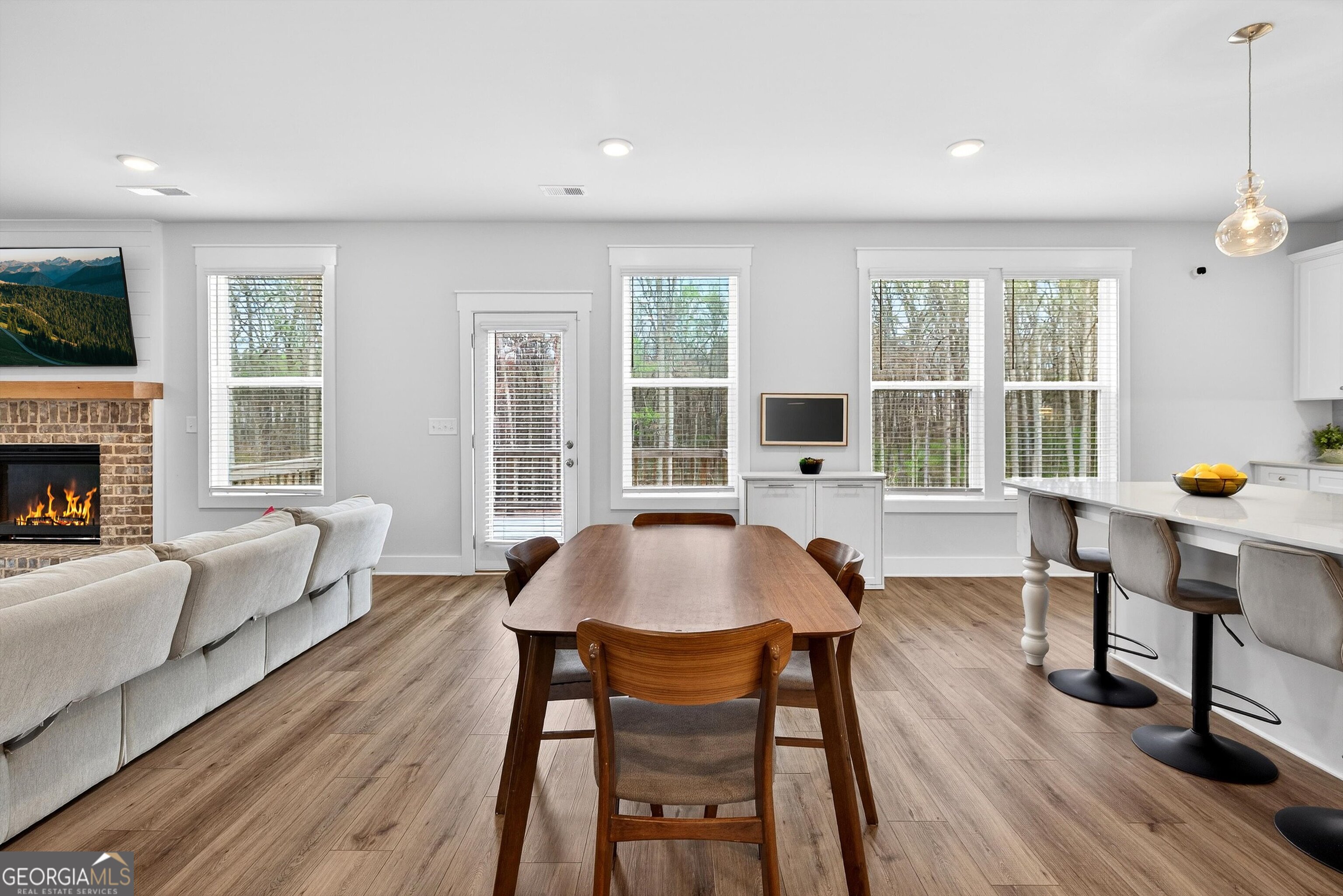 299 Saddleridge Trail Senoia, GA 30276 - Photo 10 of 56 a view of a dining room with furniture window and wooden floor