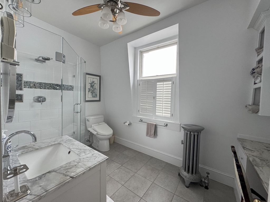 31 South Main Street, Unit 31 Cohasset, MA 02025 - Photo 16 of 30 a bathroom with a granite countertop sink a toilet and shower
