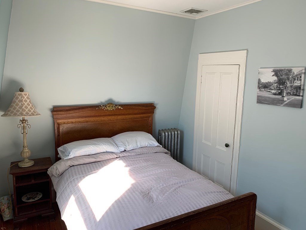 31 South Main Street, Unit 31 Cohasset, MA 02025 - Photo 19 of 30 a bedroom with a bed and a window