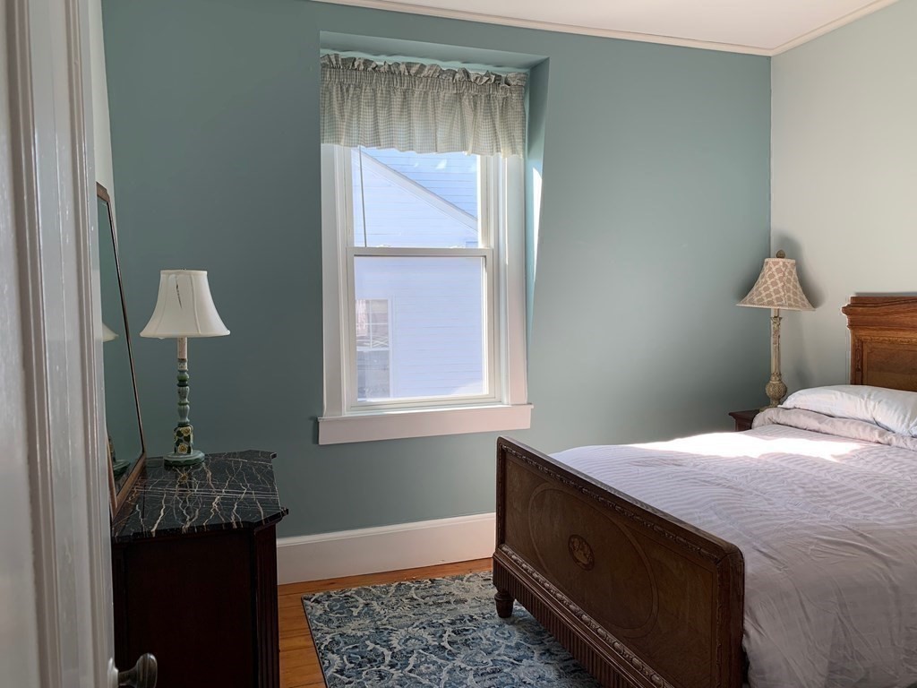 31 South Main Street, Unit 31 Cohasset, MA 02025 - Photo 20 of 30 a bedroom with a bed and a window