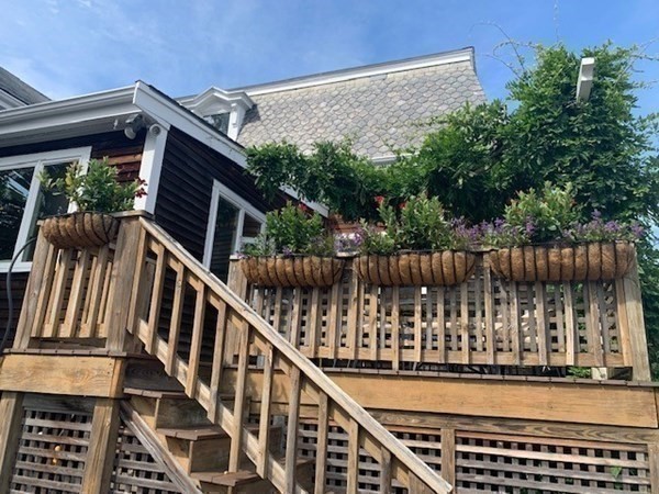 31 South Main Street, Unit 31 Cohasset, MA 02025 - Photo 27 of 30 a view of balcony with wooden floor and fence