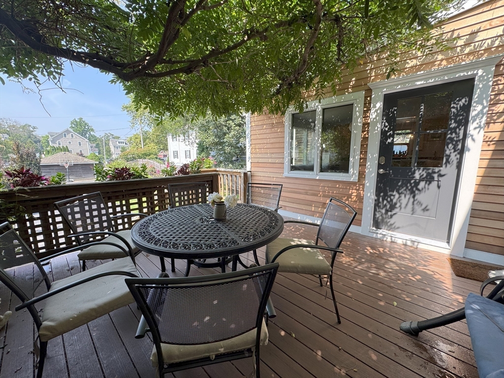 31 South Main Street, Unit 31 Cohasset, MA 02025 - Photo 28 of 30 a view of a chairs and table on the deck