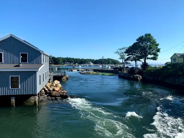 a wooden deck with lake view