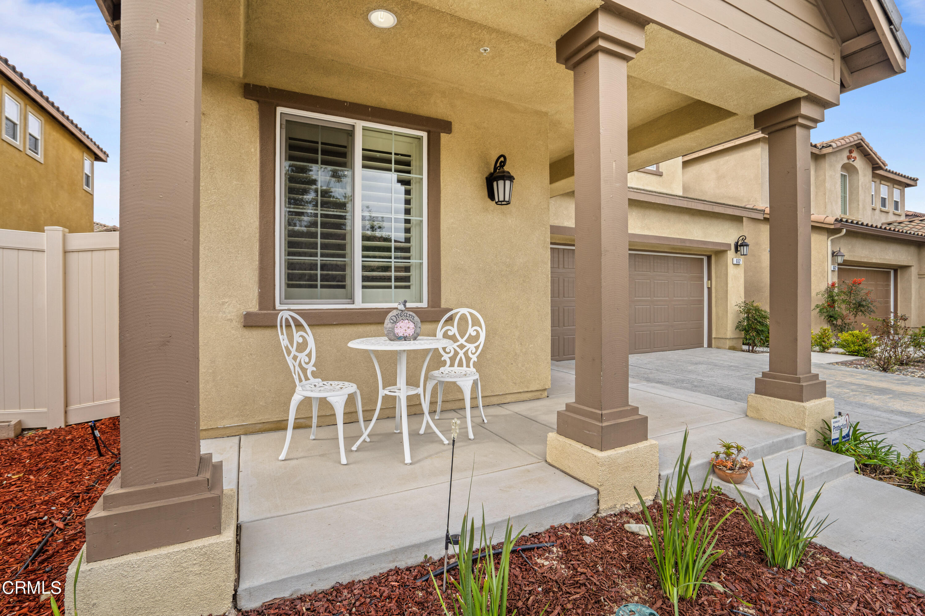 652 Xanadu Way Oxnard, CA 93036 - Photo 14 of 68 a view of a patio with table and chairs and potted plants