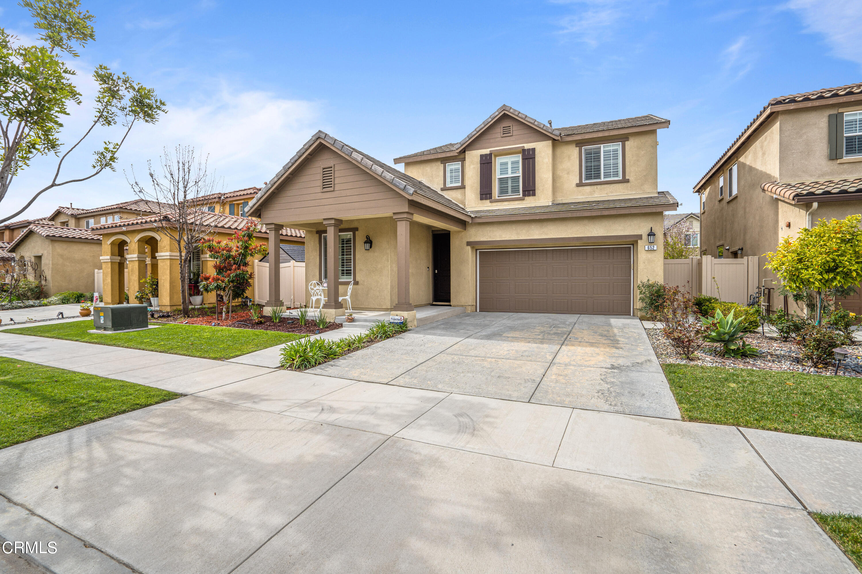 652 Xanadu Way Oxnard, CA 93036 - Photo 16 of 68 a front view of a house with a yard