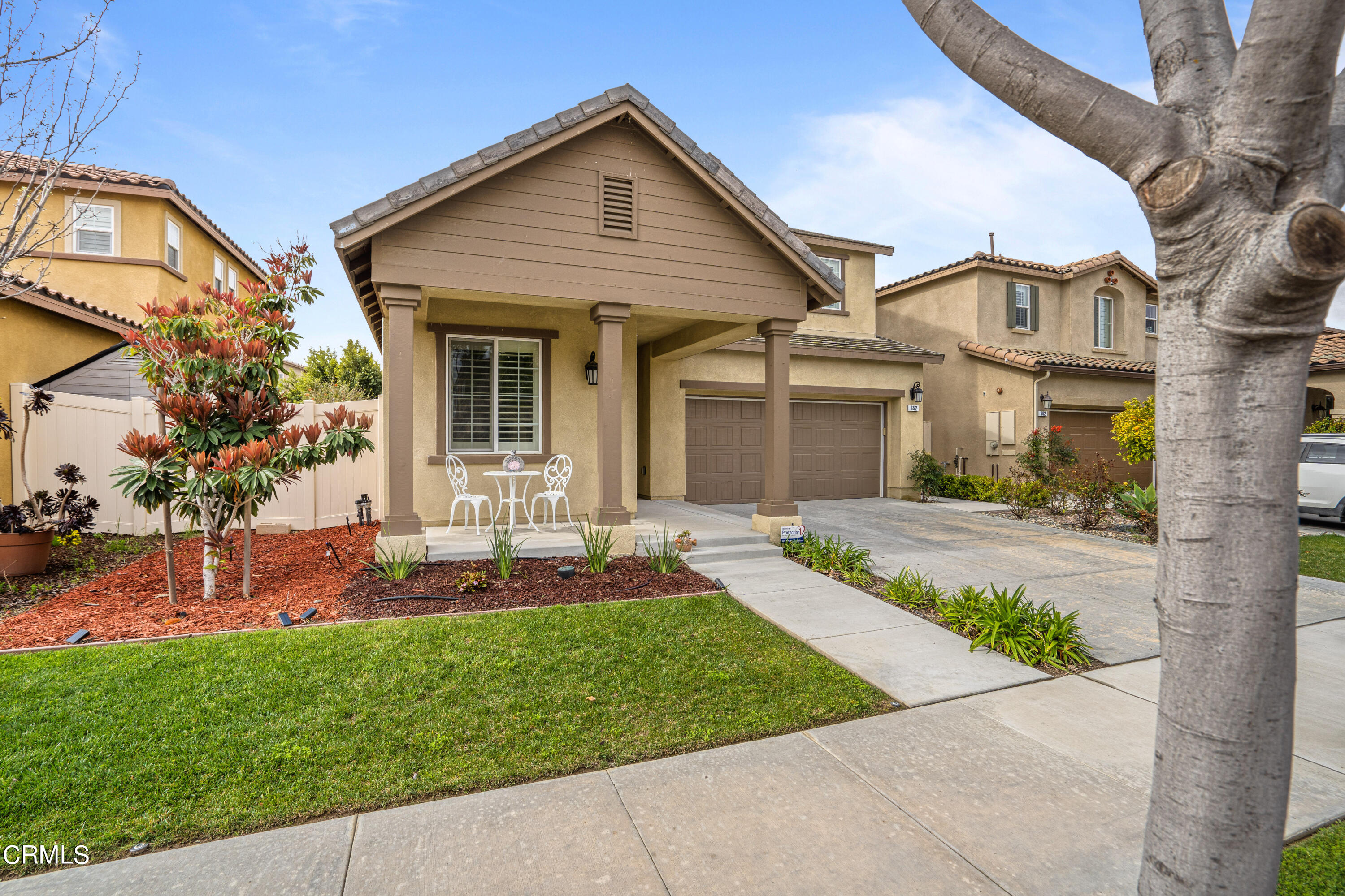 652 Xanadu Way Oxnard, CA 93036 - Photo 18 of 68 a front view of a house with a yard and seating area