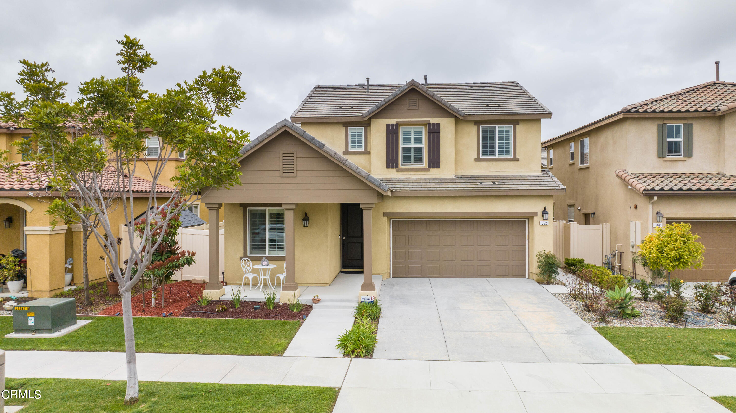 652 Xanadu Way Oxnard, CA 93036 - Photo 19 of 68 a front view of a house with garden