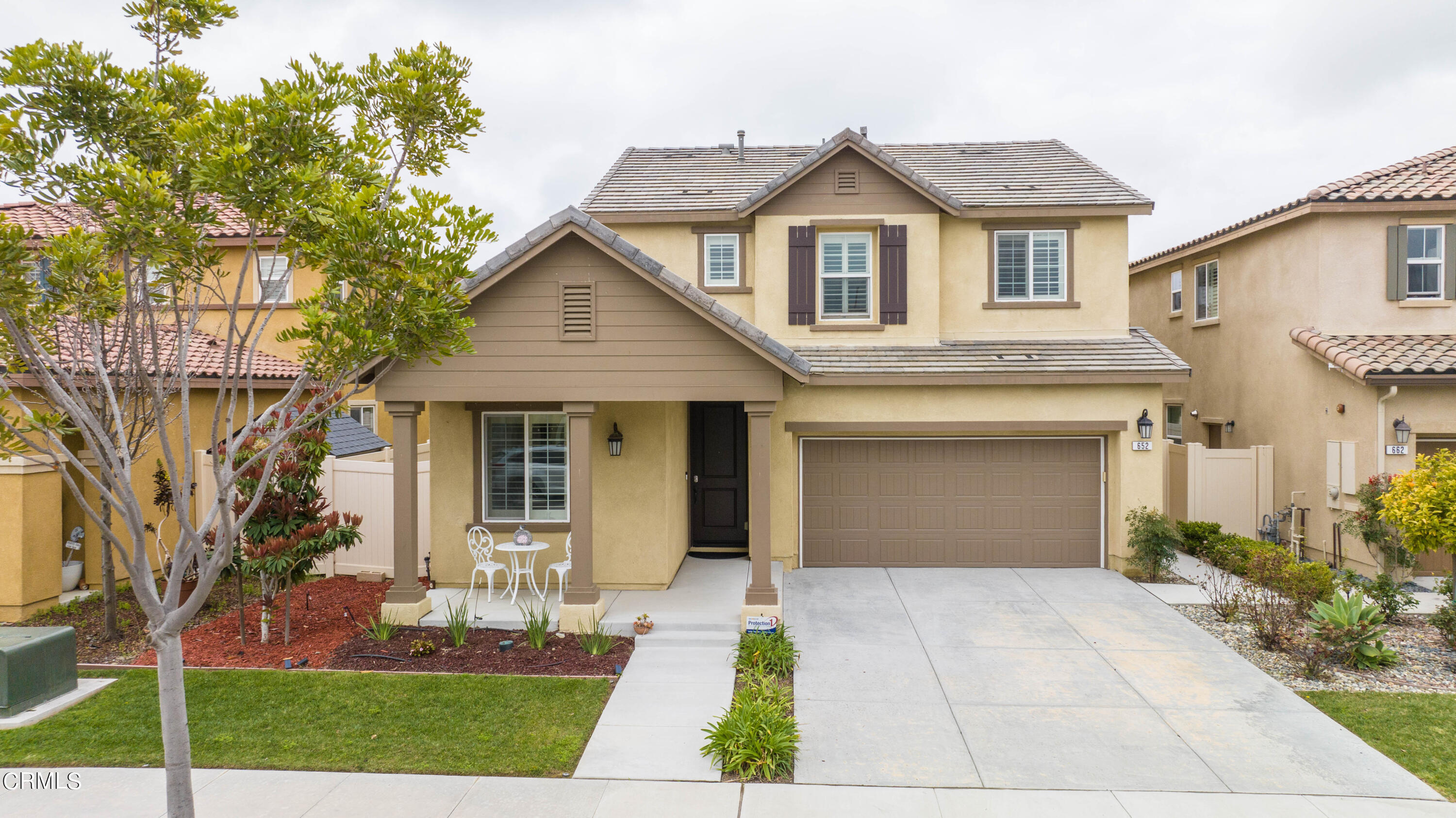 652 Xanadu Way Oxnard, CA 93036 - Photo 20 of 68 a front view of a house with garden
