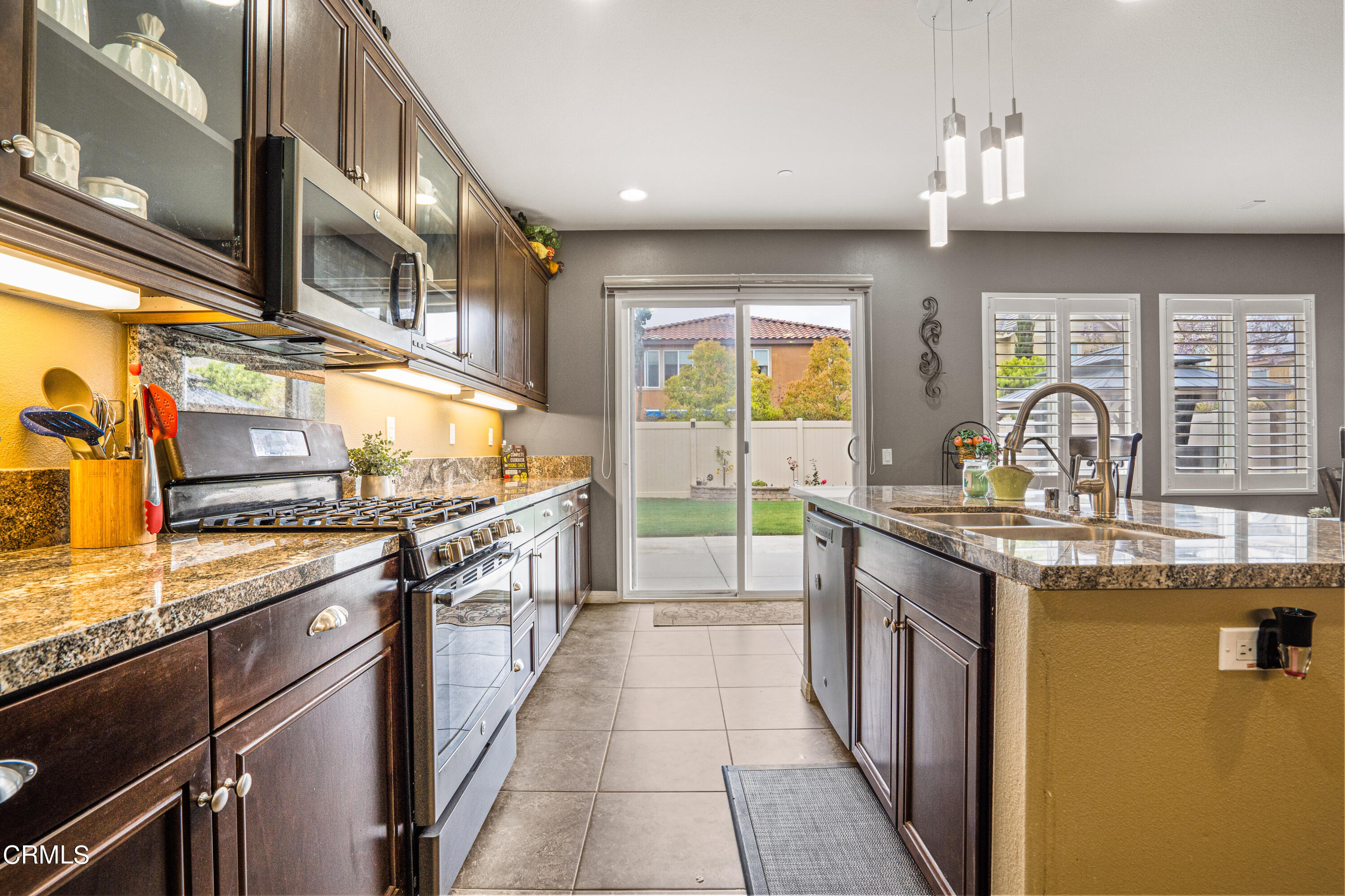 652 Xanadu Way Oxnard, CA 93036 - Photo 29 of 68 a kitchen with stainless steel appliances granite countertop a sink and a stove