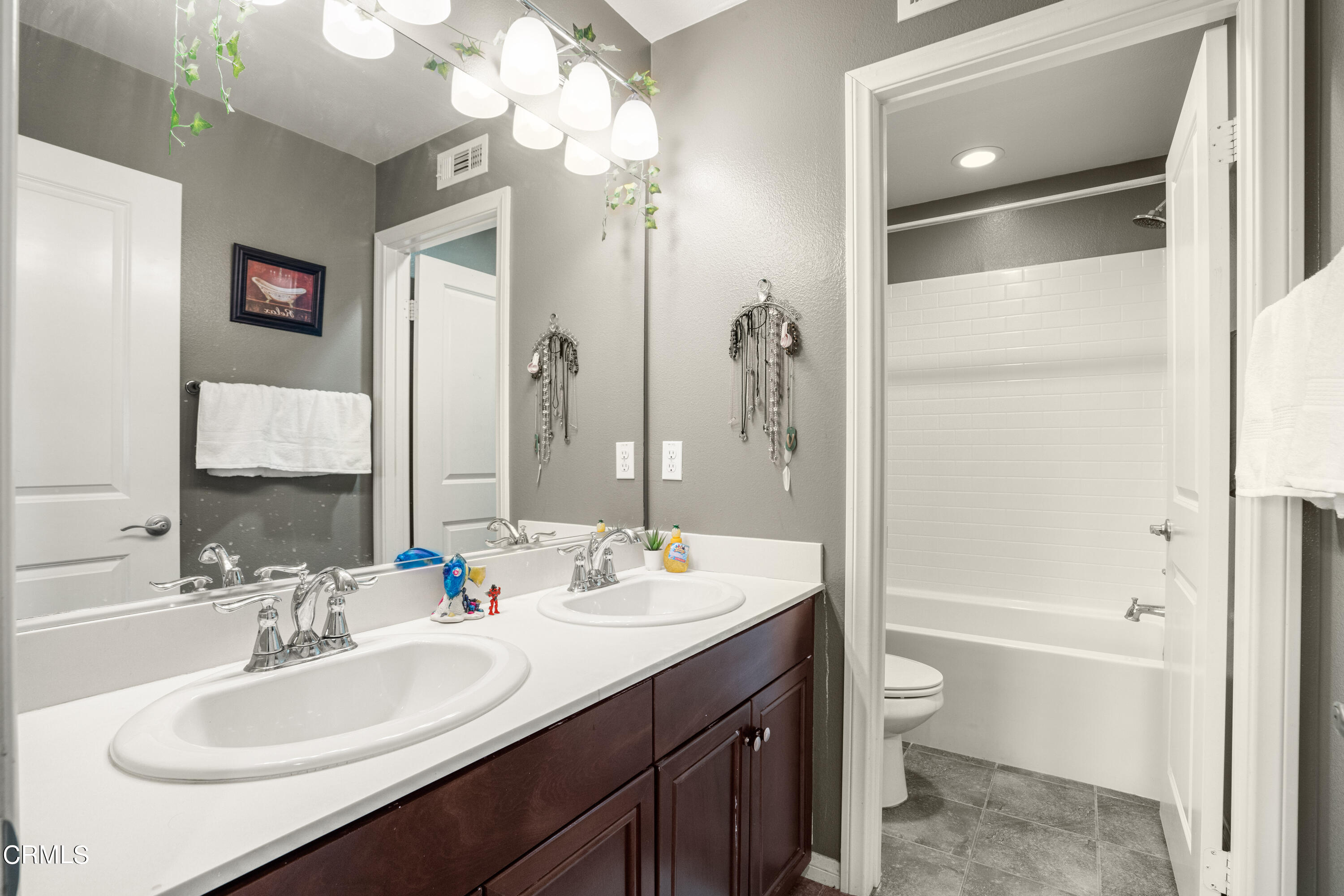 652 Xanadu Way Oxnard, CA 93036 - Photo 31 of 68 a bathroom with a sink a toilet and shower