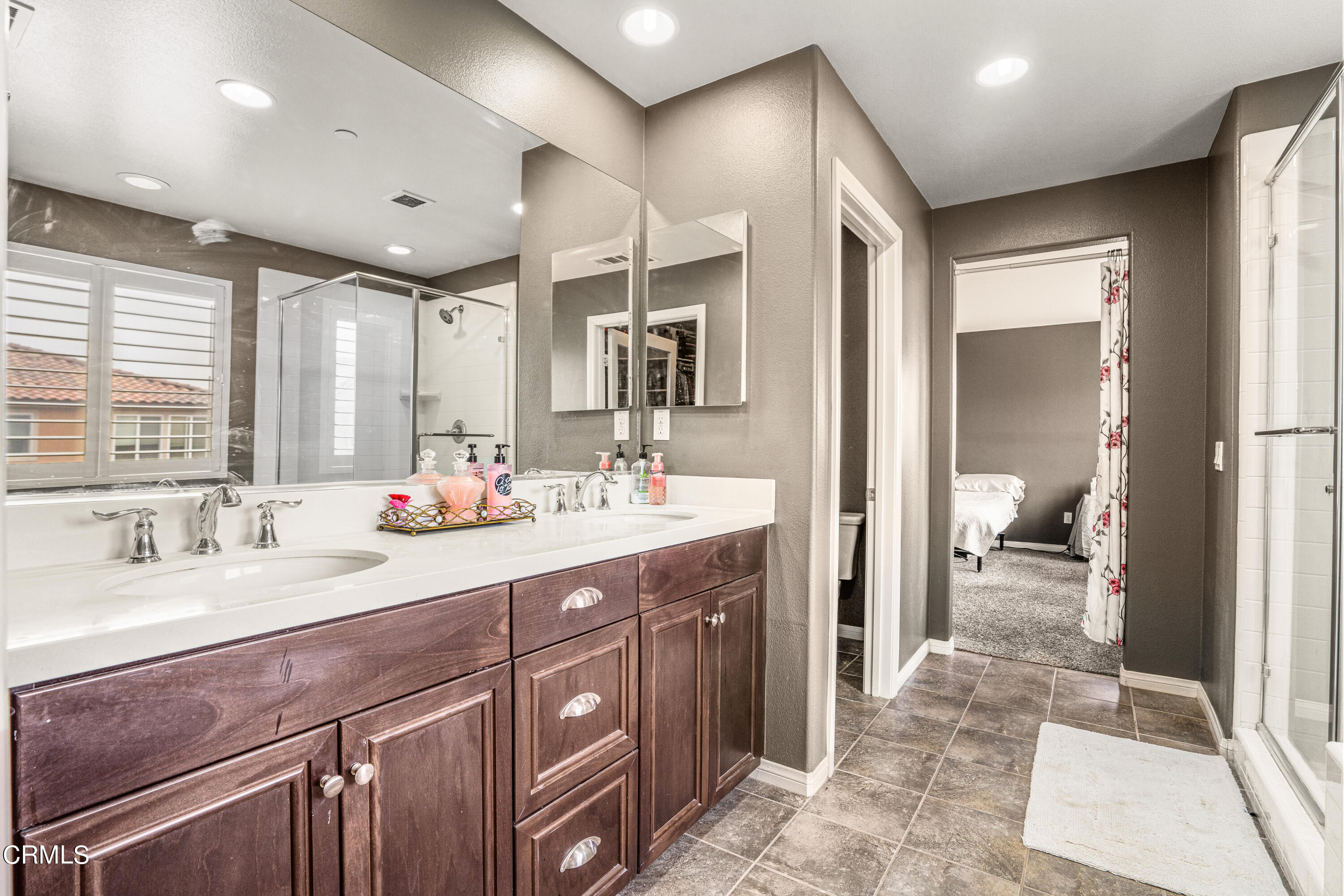 652 Xanadu Way Oxnard, CA 93036 - Photo 32 of 68 a spacious bathroom with a double vanity sink a mirror and a shower