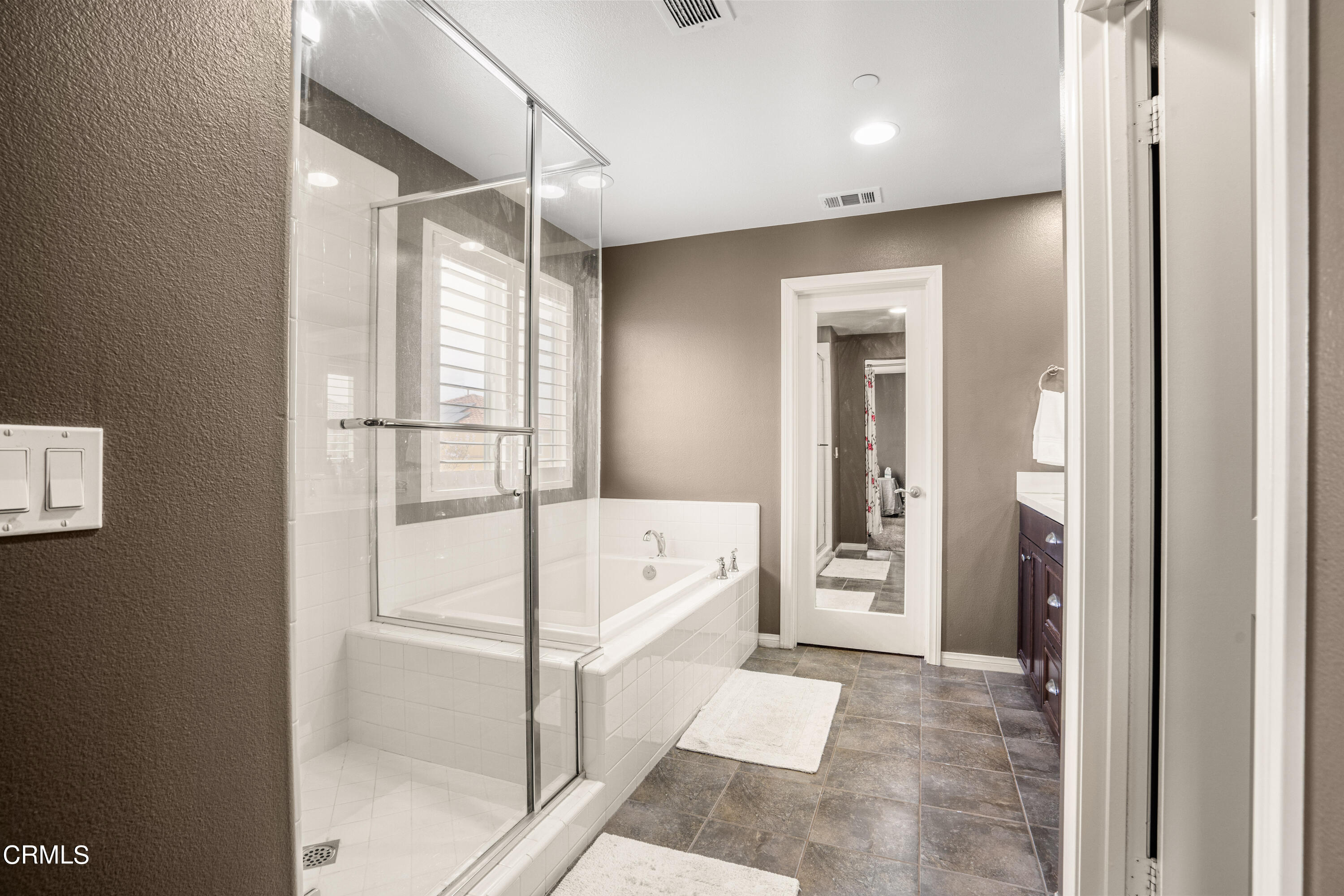 652 Xanadu Way Oxnard, CA 93036 - Photo 34 of 68 a bathroom with a tub shower and sink