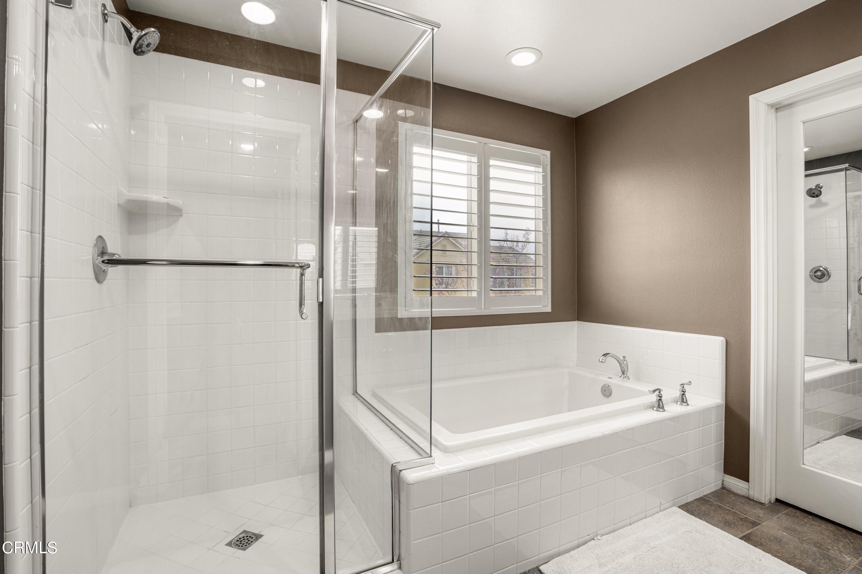 652 Xanadu Way Oxnard, CA 93036 - Photo 49 of 68 a bathroom with a bathtub and shower