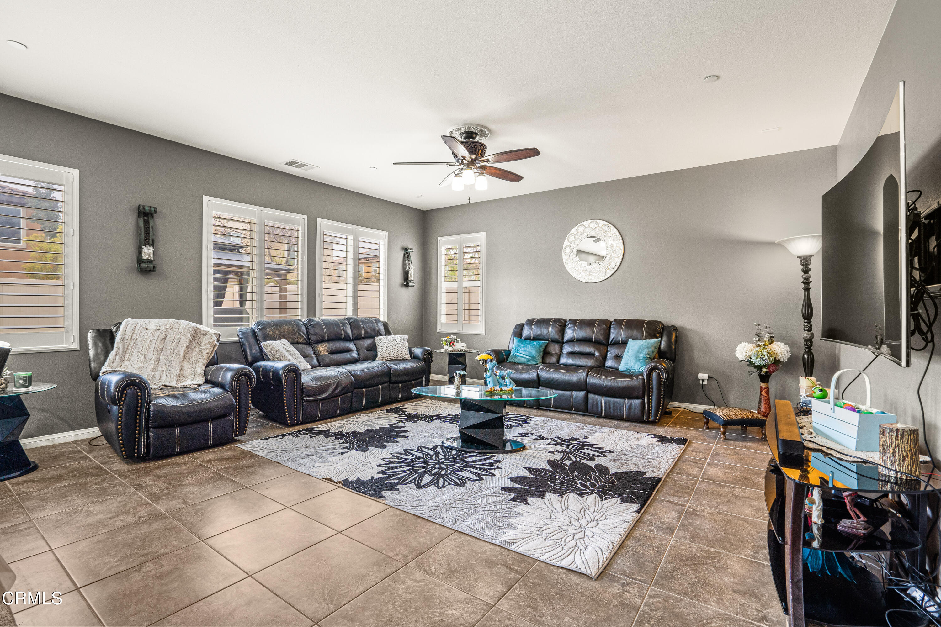 652 Xanadu Way Oxnard, CA 93036 - Photo 53 of 68 a living room with furniture a fireplace and a large window