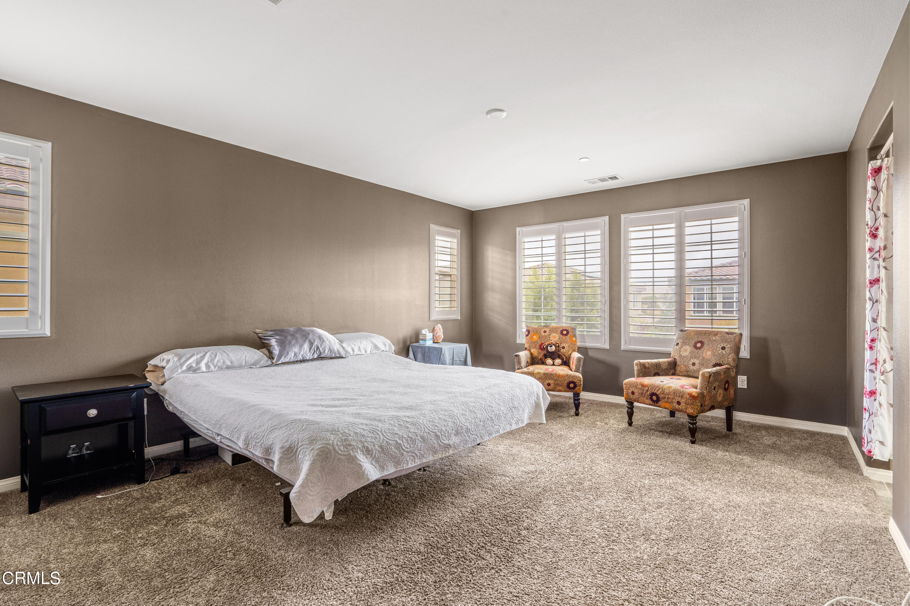 652 Xanadu Way Oxnard, CA 93036 - Photo 61 of 68 a bed room with a bed and a couch