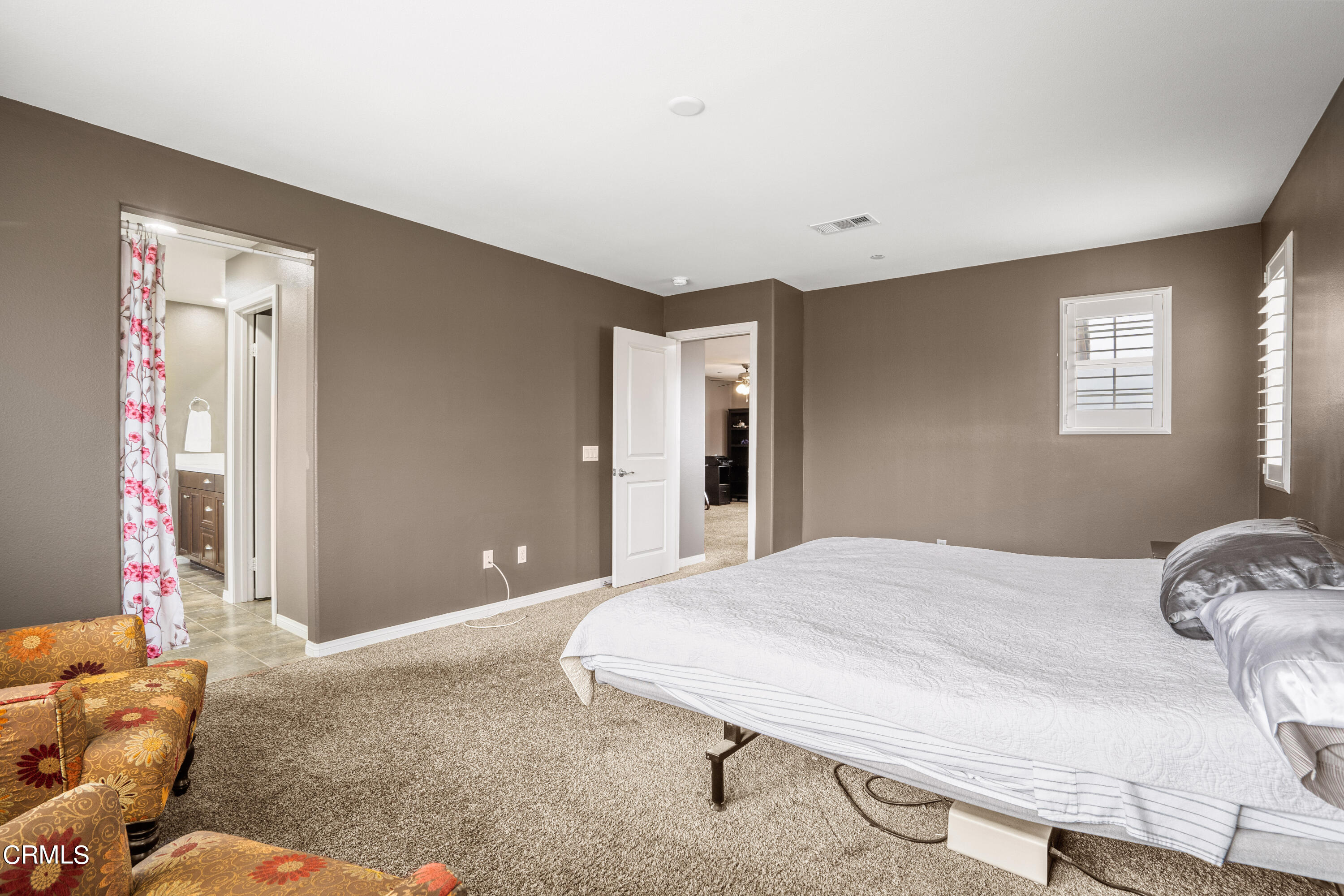 652 Xanadu Way Oxnard, CA 93036 - Photo 62 of 68 a bedroom with a bed and wooden floor