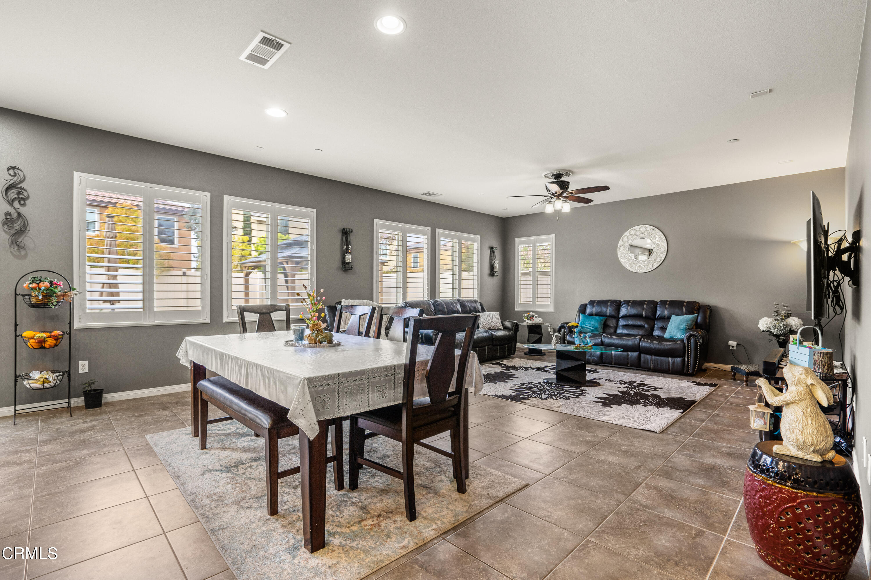 652 Xanadu Way Oxnard, CA 93036 - Photo 67 of 68 a living room with furniture a flat screen tv and a large window