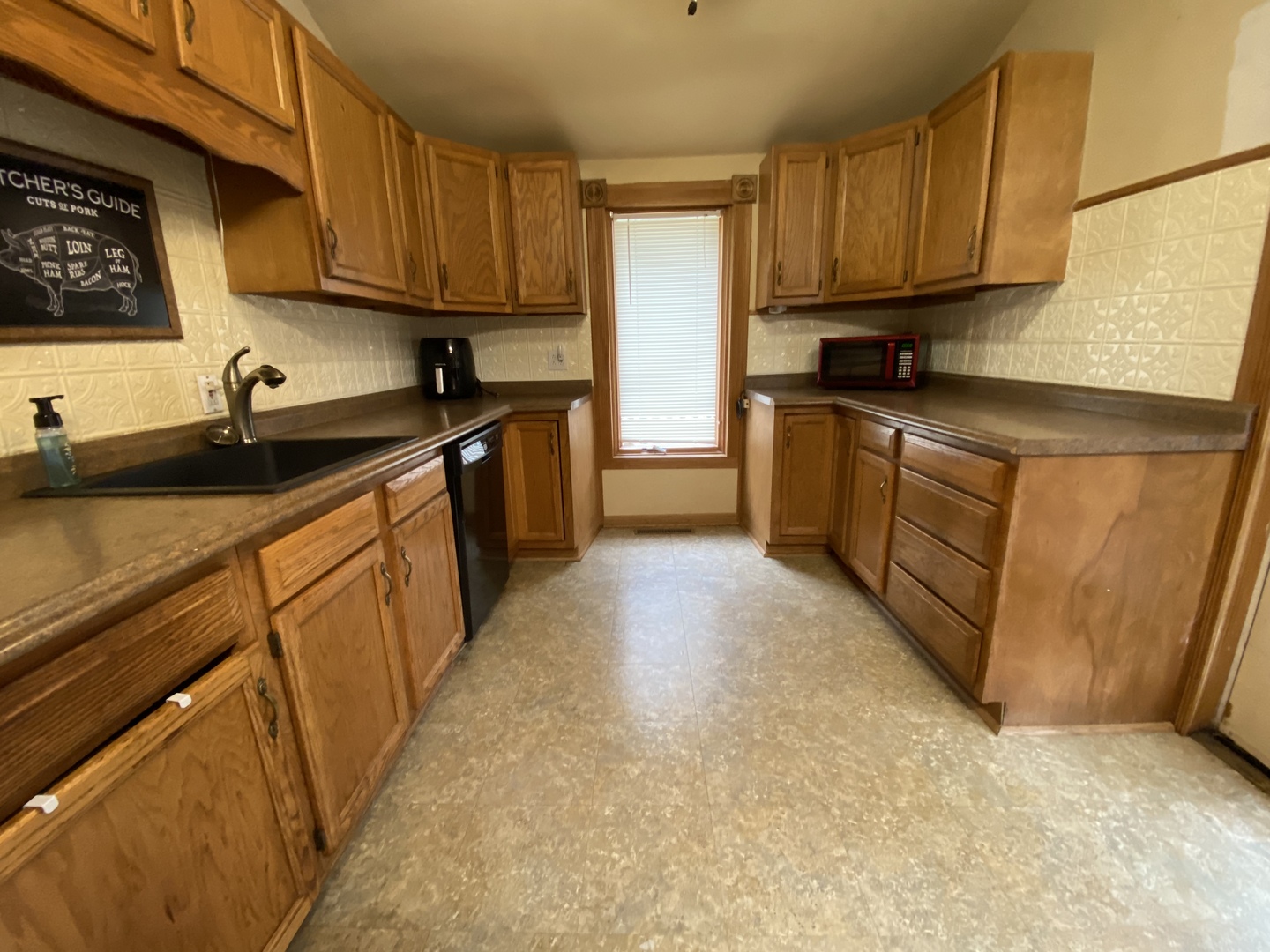 601 East Plumb Street Ransom, IL 60470 - Photo 5 of 21 a kitchen with granite countertop a sink stainless steel appliances and cabinets