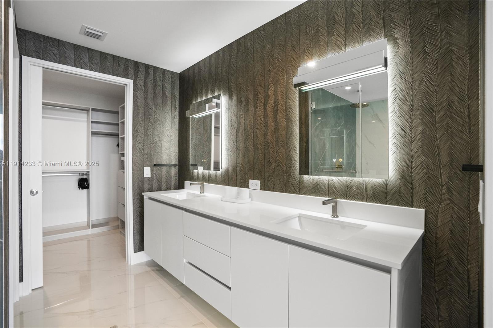 700 Northeast 24th Street, Unit 3905 Miami, FL 33137 - Photo 19 of 46 a bathroom with a sink and a mirror