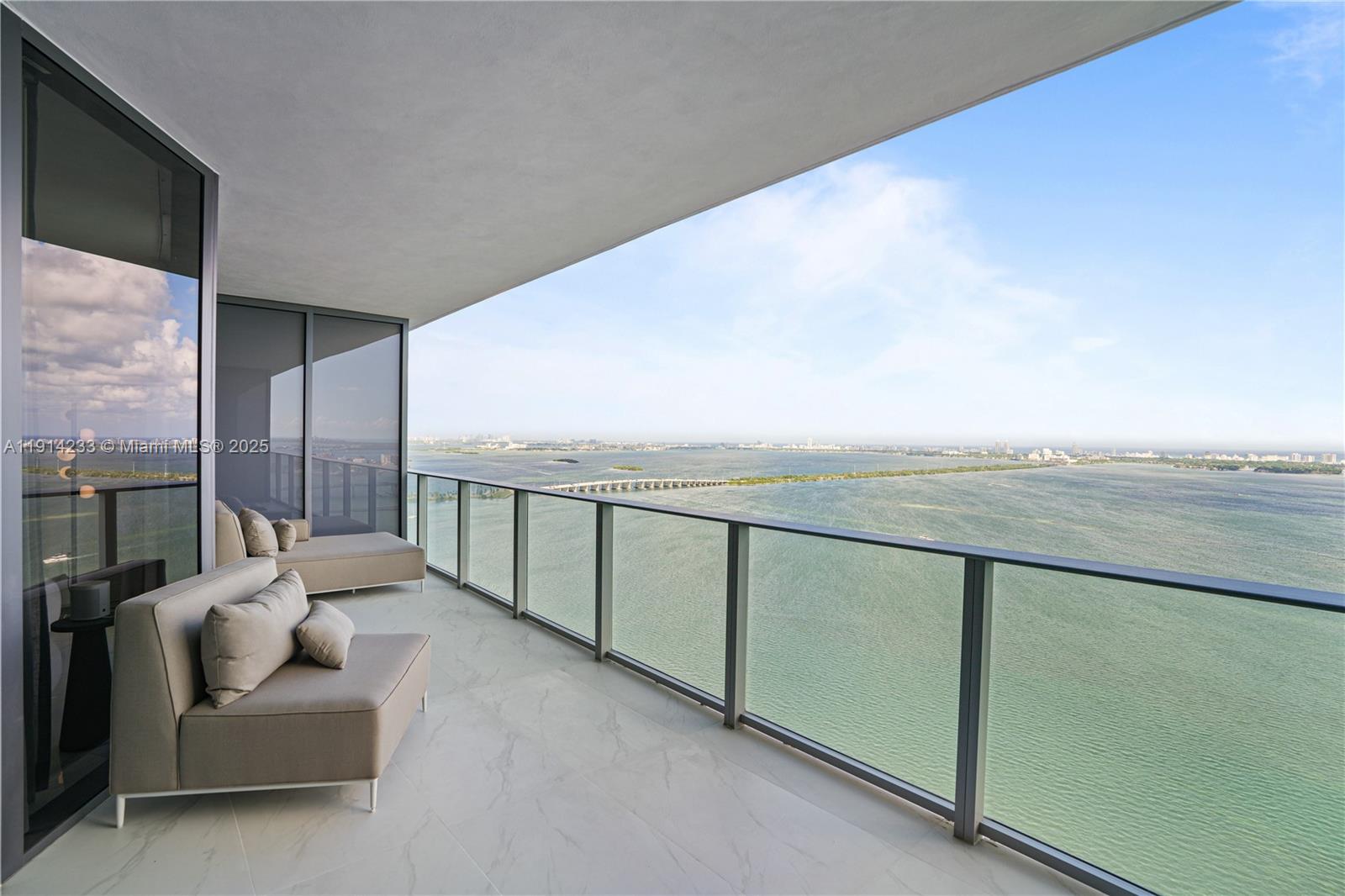 700 Northeast 24th Street, Unit 3905 Miami, FL 33137 - Photo 2 of 46 a terrace with outdoor seating and city view