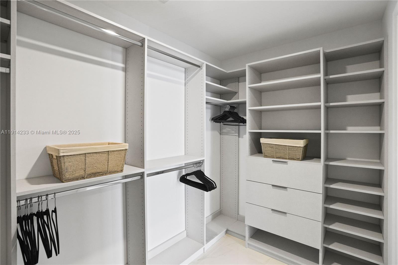 700 Northeast 24th Street, Unit 3905 Miami, FL 33137 - Photo 21 of 46 a view of walk in closet with empty racks