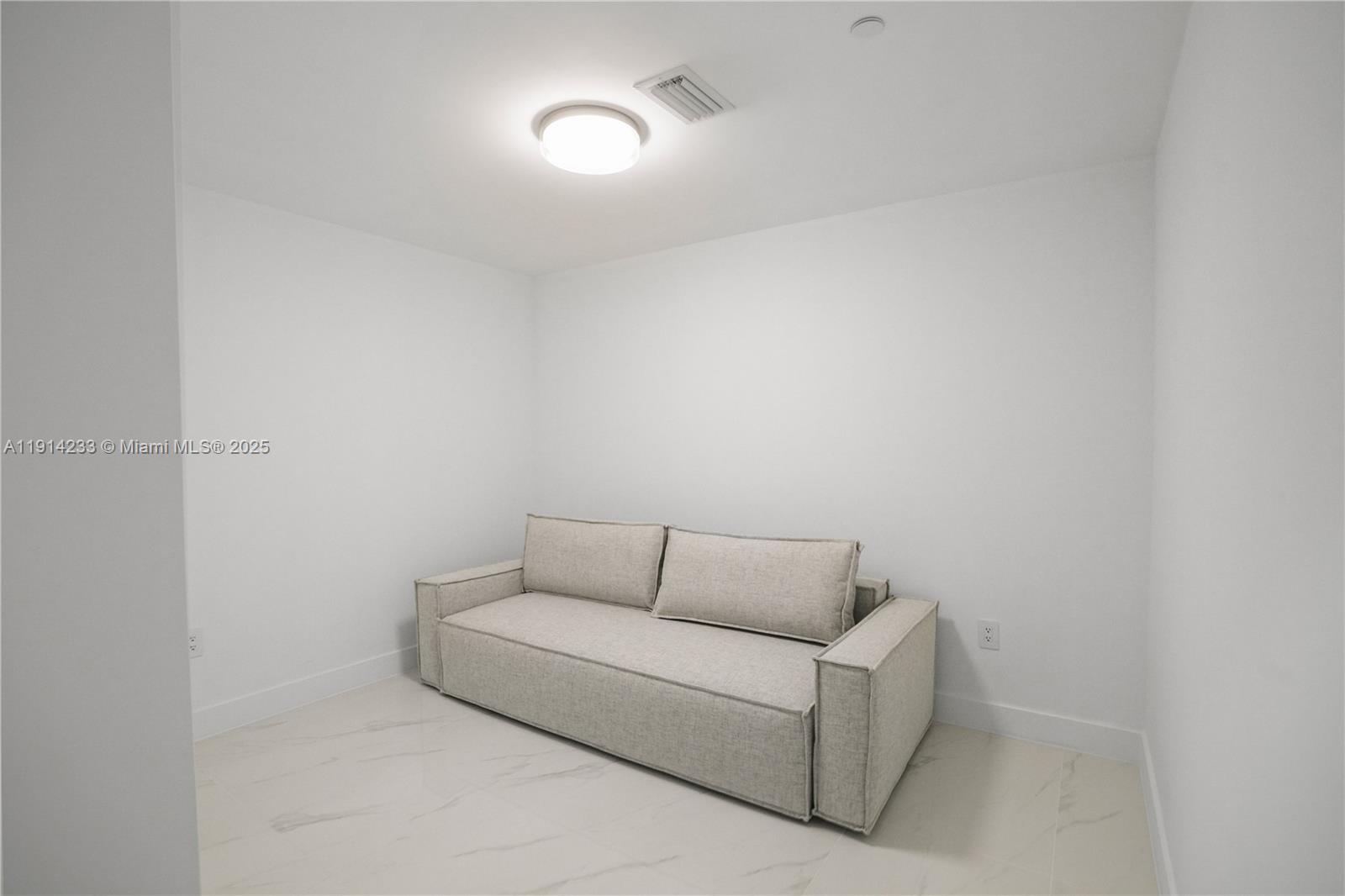 700 Northeast 24th Street, Unit 3905 Miami, FL 33137 - Photo 24 of 46 a living room with furniture and a couch