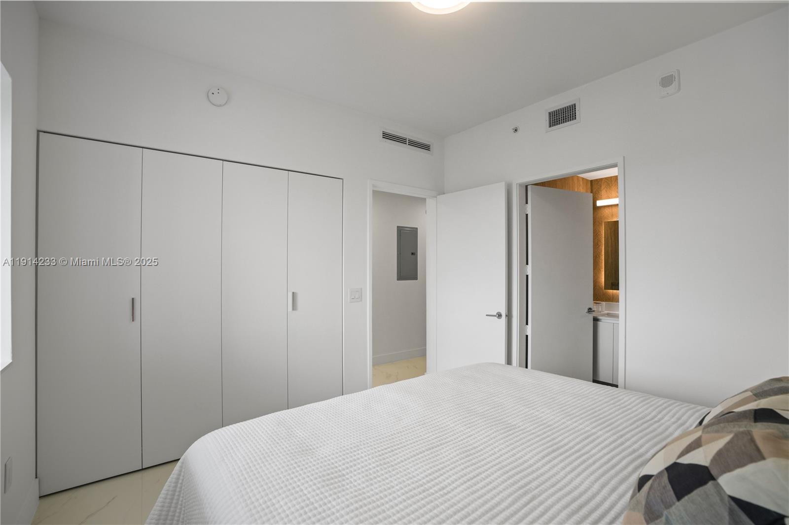 700 Northeast 24th Street, Unit 3905 Miami, FL 33137 - Photo 26 of 46 a bedroom with a bed and a shower