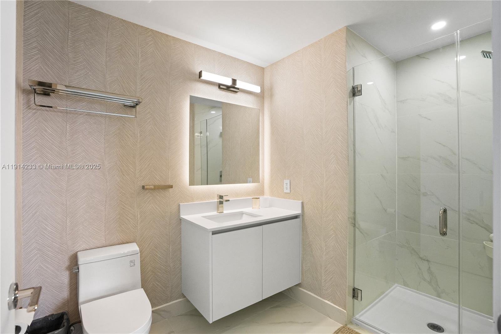 700 Northeast 24th Street, Unit 3905 Miami, FL 33137 - Photo 29 of 46 a bathroom with a toilet sink and shower