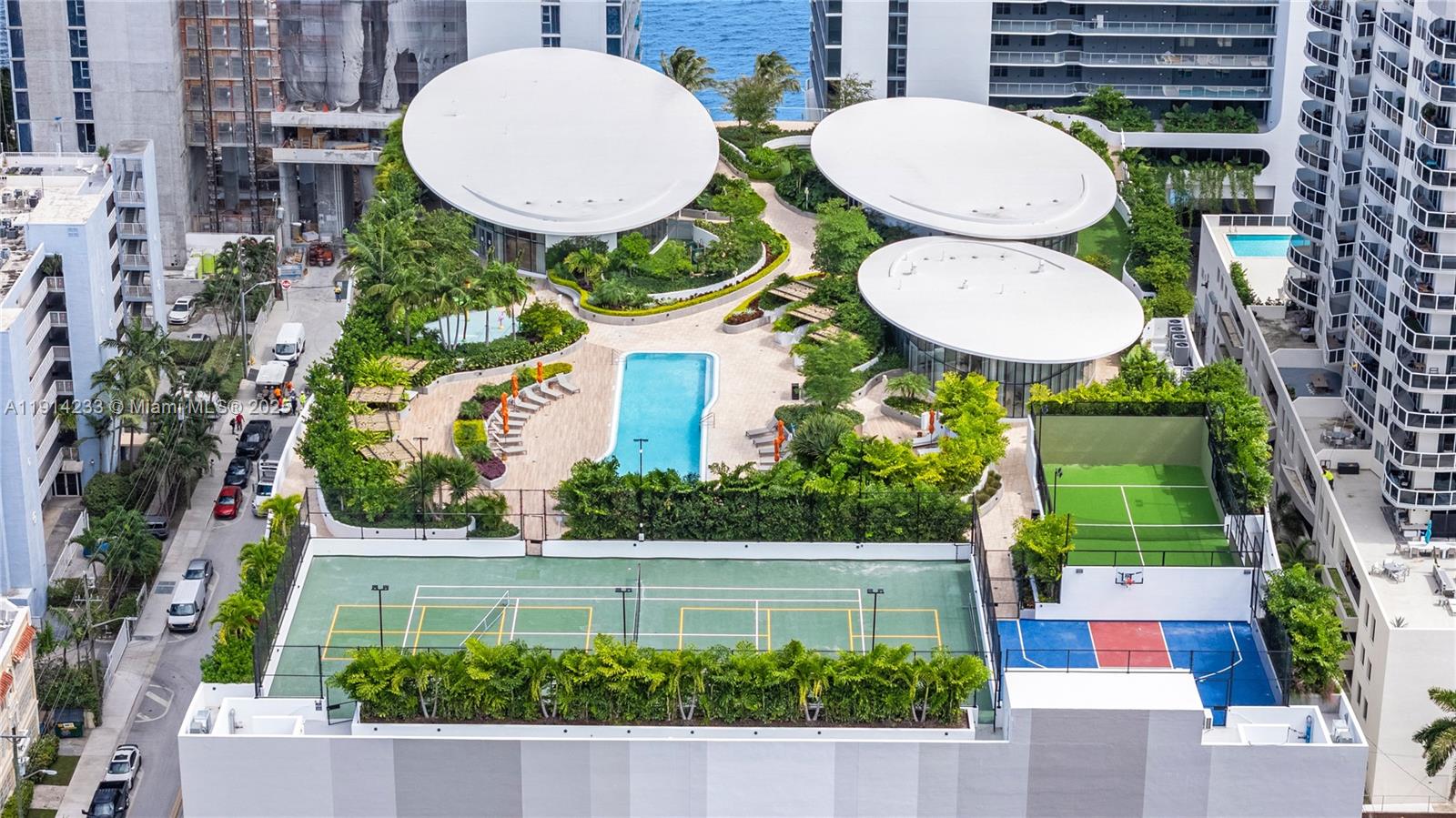 700 Northeast 24th Street, Unit 3905 Miami, FL 33137 - Photo 38 of 46 a view of a backyard with plants and a fountain