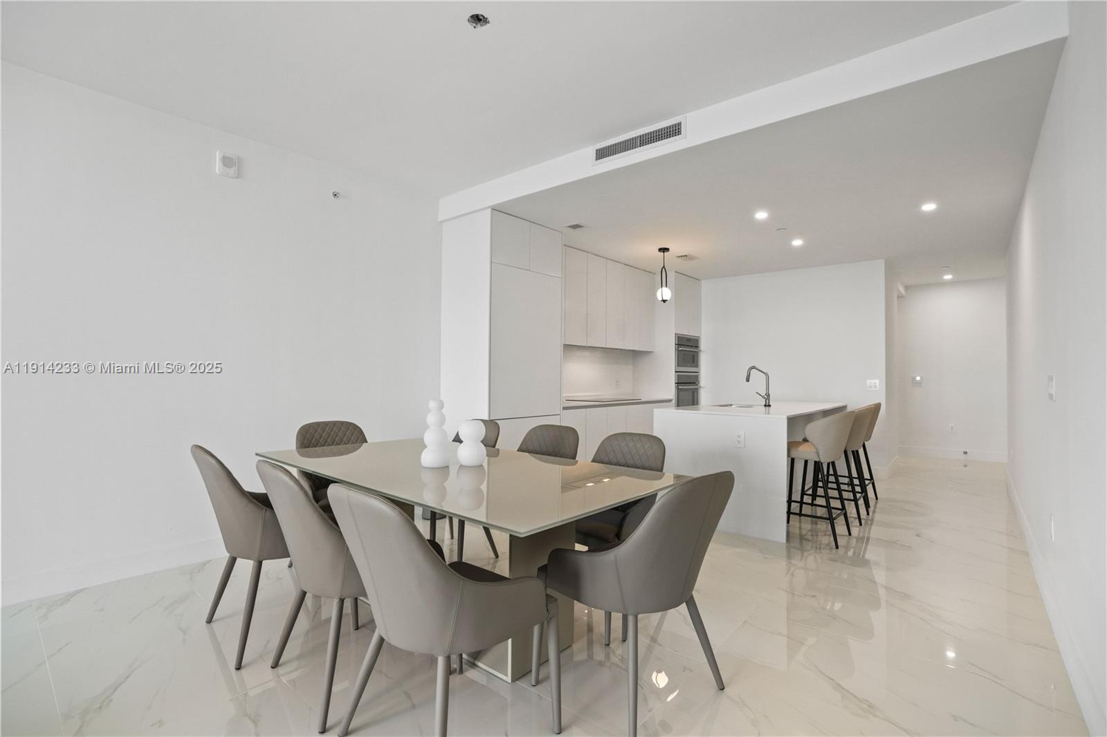 700 Northeast 24th Street, Unit 3905 Miami, FL 33137 - Photo 10 of 46 a view of a dining room with furniture
