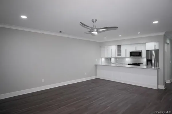 a view of kitchen with wooden floor