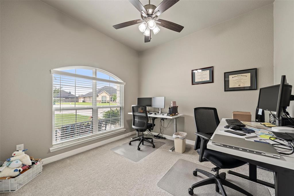 828 Agile Street Hewitt, TX 76643 - Photo 16 of 30 a view of a workspace with furniture and a window