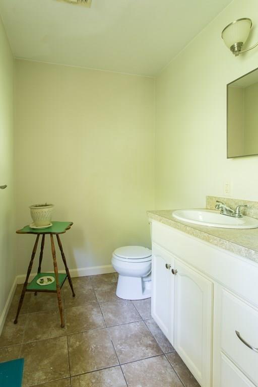 77 Lyon Road West Brookfield, MA 01585 - Photo 11 of 27 a bathroom with a granite countertop sink and a toilet