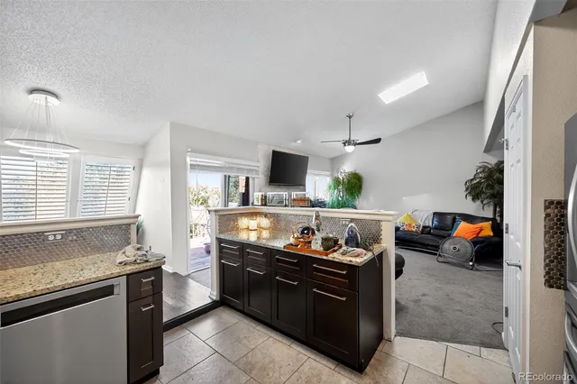 a kitchen with a sink and a stove top oven