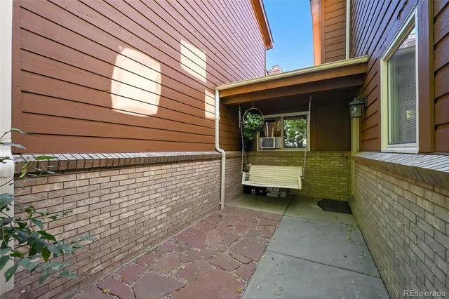 a yellow house with a outdoor space
