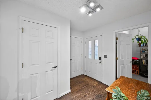 a view of a livingroom with furniture and wooden floor