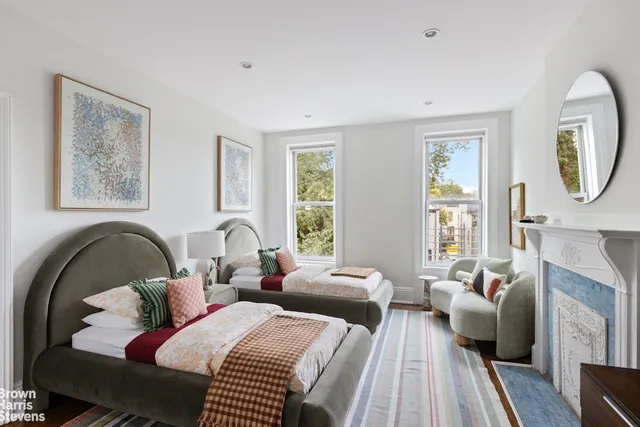 a bathroom with a shower sink vanity and mirror