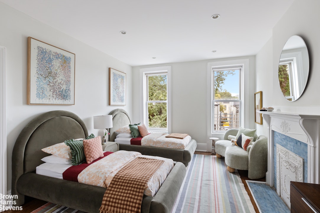 36 Rutland Road Brooklyn, NY 11225 - Photo 10 of 16 a bedroom with two beds and a large window