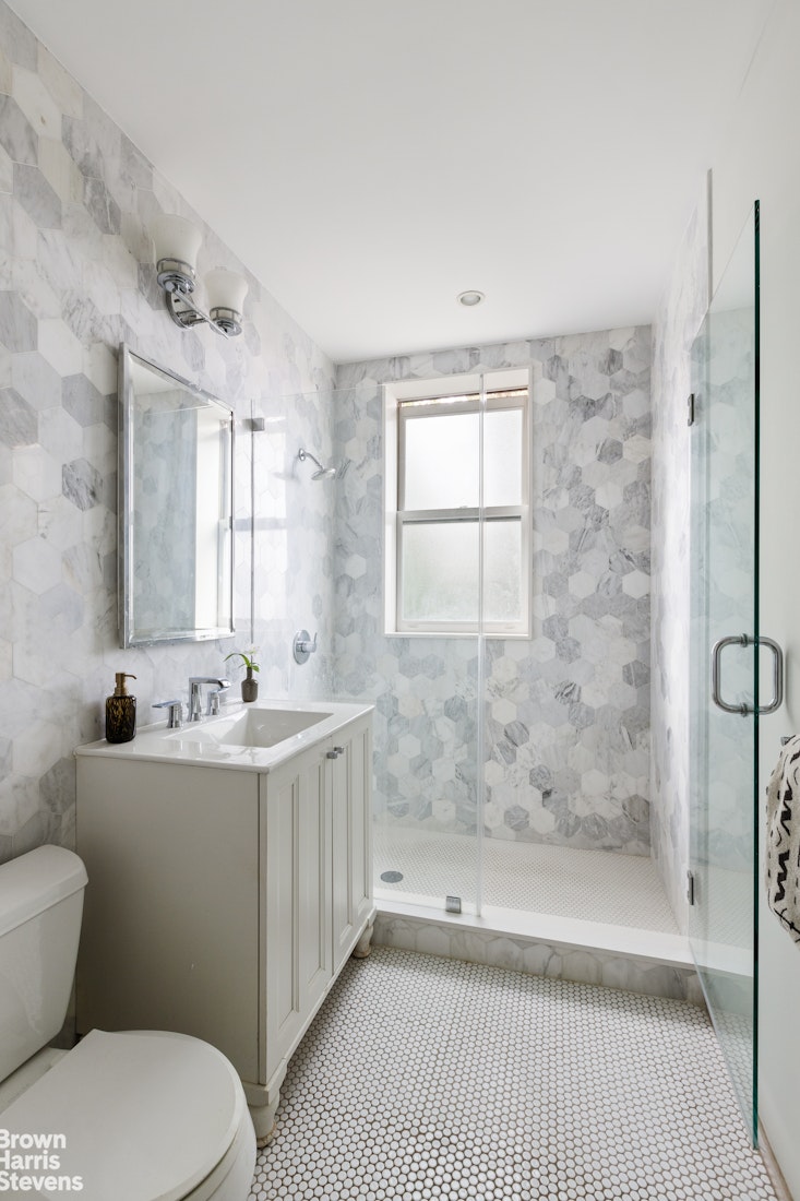 36 Rutland Road Brooklyn, NY 11225 - Photo 11 of 16 a bathroom with a sink a toilet and shower