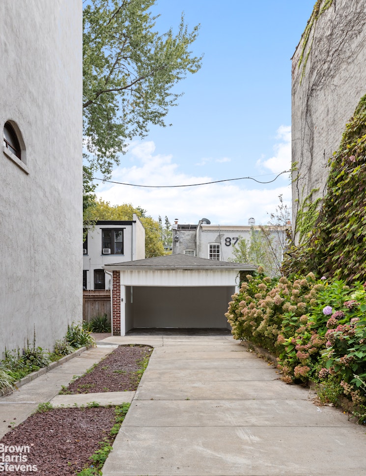 36 Rutland Road Brooklyn, NY 11225 - Photo 13 of 16 a front view of a house with a garden