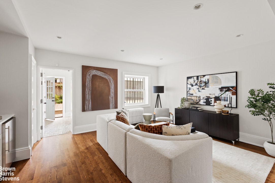 36 Rutland Road Brooklyn, NY 11225 - Photo 15 of 16 a living room with furniture and a fireplace