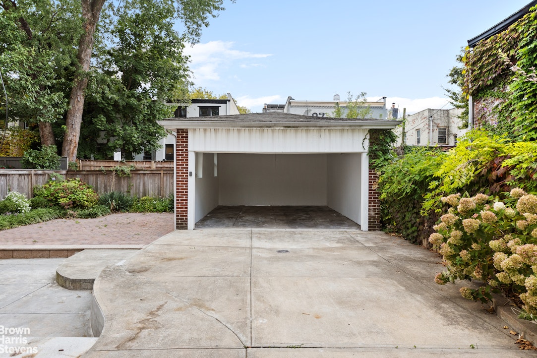 36 Rutland Road Brooklyn, NY 11225 - Photo 2 of 16 a view of a patio with plants and large trees
