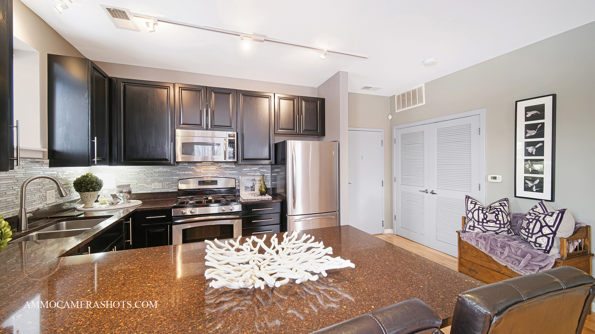 925 South Lytle Street, Unit A Chicago, IL 60607 - Photo 20 of 41 a kitchen with stainless steel appliances kitchen island granite countertop a refrigerator and a stove top oven