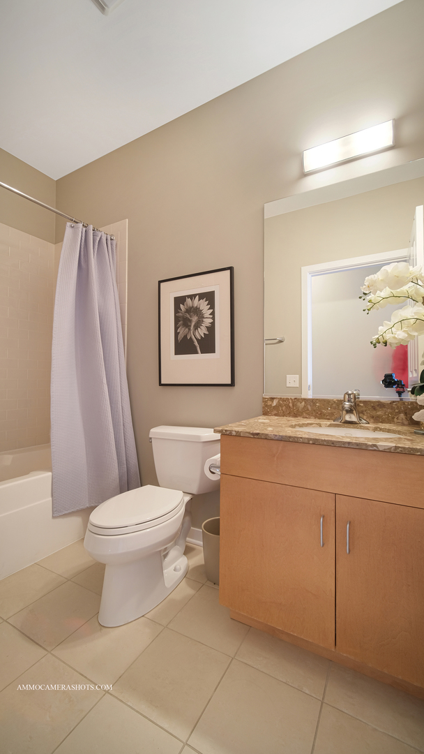 925 South Lytle Street, Unit A Chicago, IL 60607 - Photo 28 of 41 a bathroom with a toilet sink and a mirror