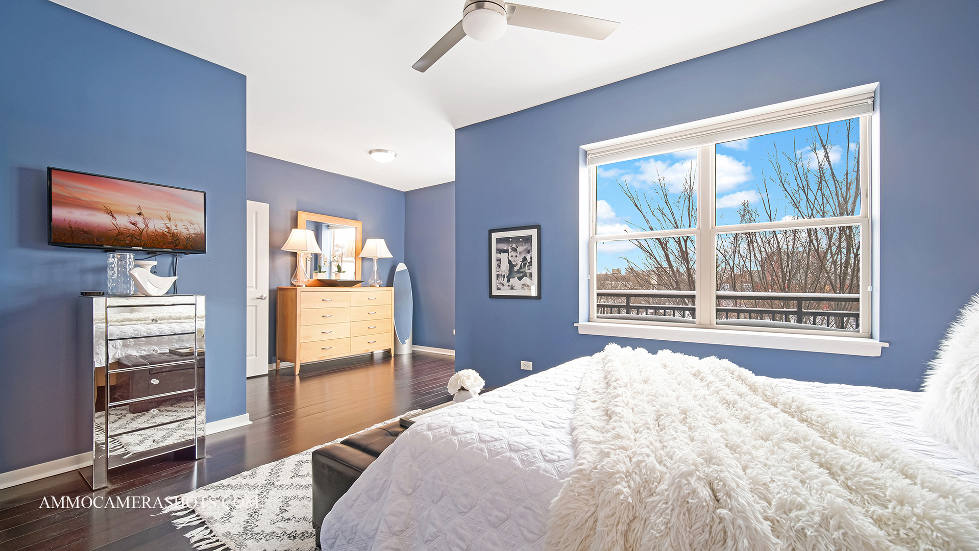 925 South Lytle Street, Unit A Chicago, IL 60607 - Photo 31 of 41 a bedroom with a bed and a flat tv screen on dresser