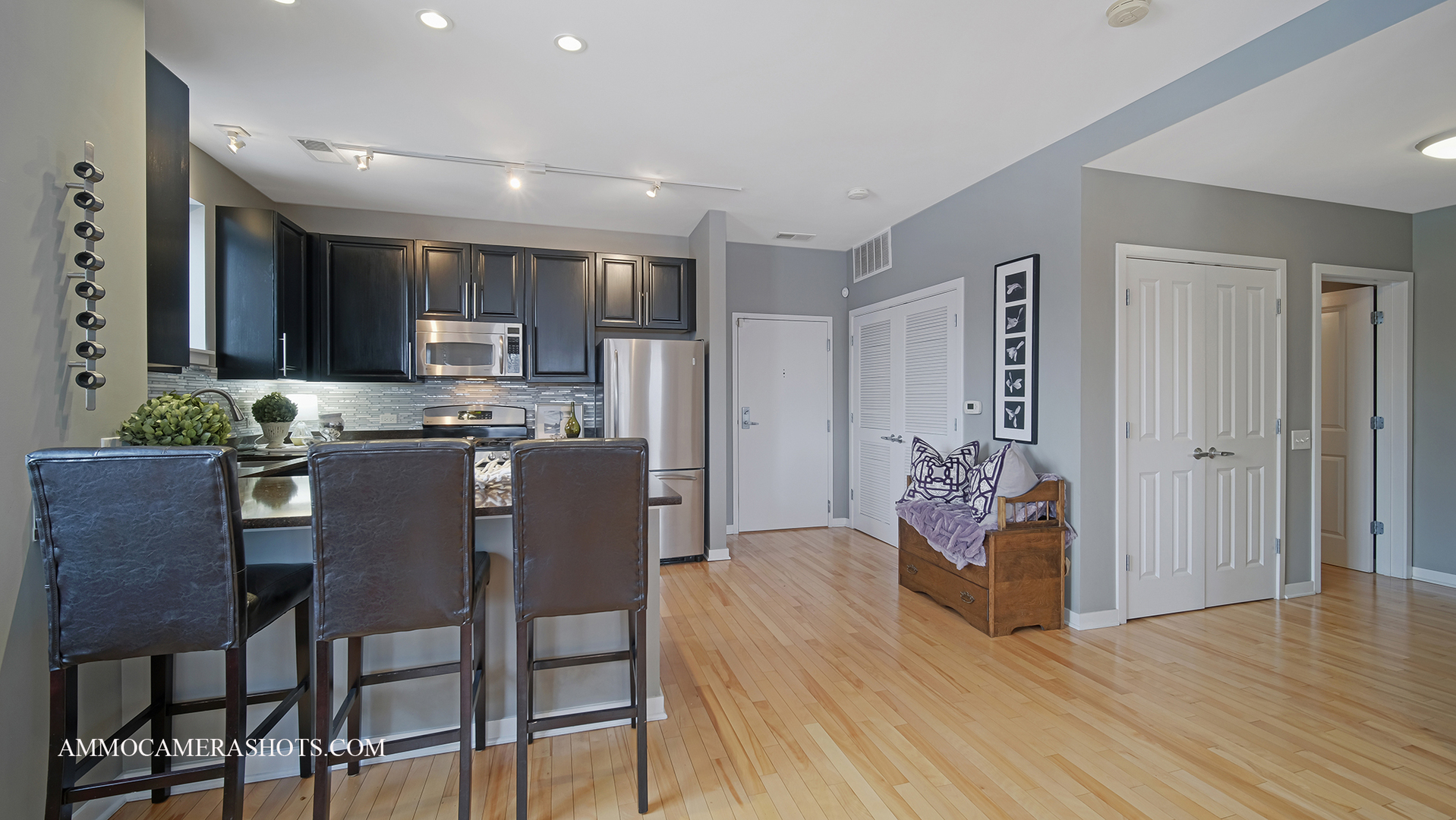 925 South Lytle Street, Unit A Chicago, IL 60607 - Photo 7 of 41 a kitchen with stainless steel appliances kitchen island granite countertop a refrigerator and a stove top oven