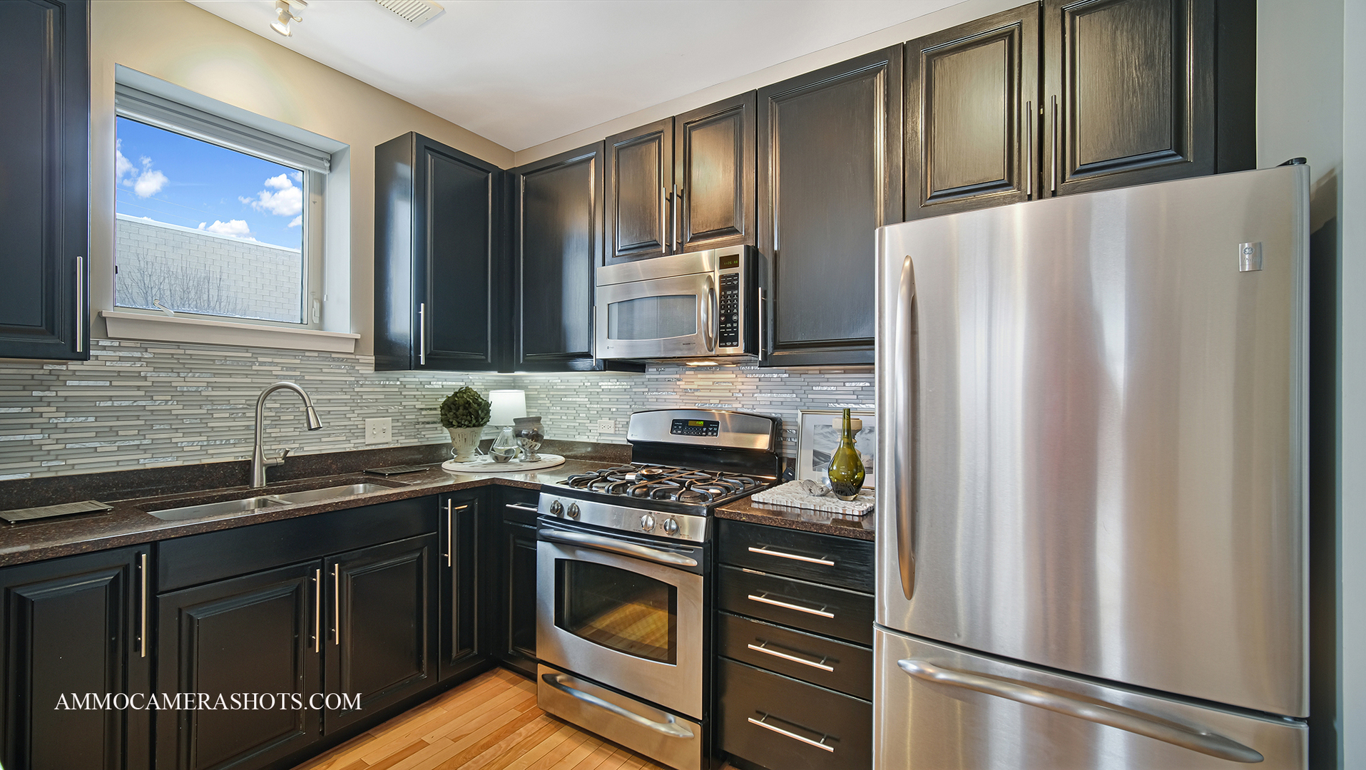 925 South Lytle Street, Unit A Chicago, IL 60607 - Photo 10 of 41 a kitchen with stainless steel appliances a refrigerator sink and microwave