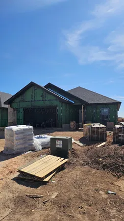 a view of house with yard and outdoor seating